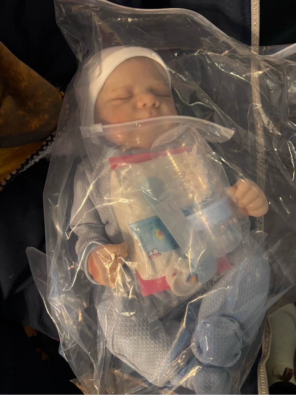 Realistic Baby Doll in Light Blue Outfit with White Cap